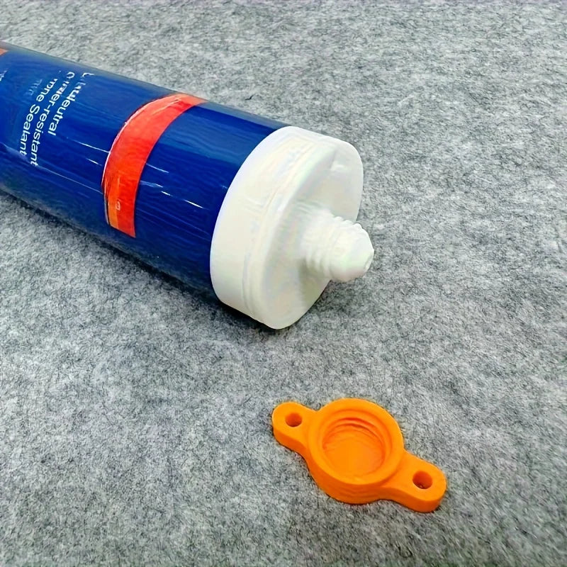 Silicone seal cap and seal gun nozzle removal tool, silicone seal cap used for open core tubes to prevent rapid drying